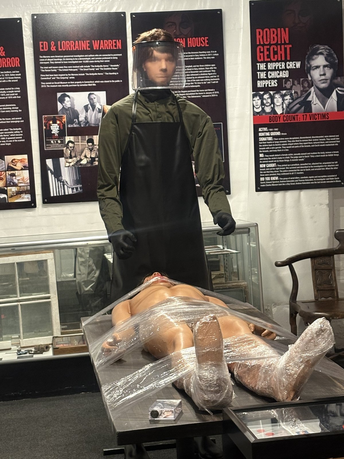 The Dexter Room — the kill-suit figure standing over the plastic-wrapped kill table
